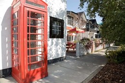 Red telephone booth on the Georgetown Inn and Pub's patio