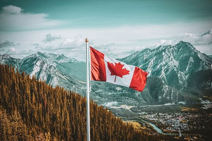 Canadian Flag waving high above Banff Townsite