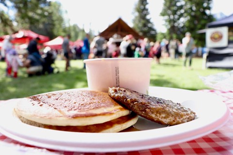 Canada Day Pancake breakfast on a plate in Centennial Park in Canmore, AB
