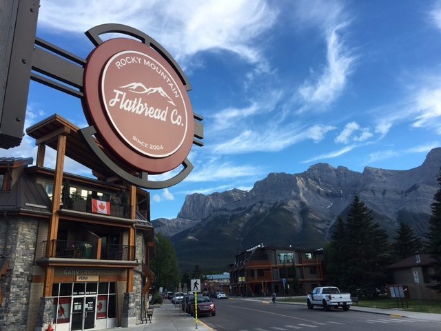 Rocky Mountain Flatbread Co. in Canmore, Alberta with Ha Ling Peak, Miner's Peak and Ship's Prow in the background.