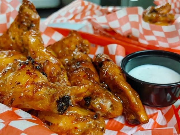 A basket of Chicken Wings with a side of dip - the Wednesday Special at The Drake in Canmore, Alberta