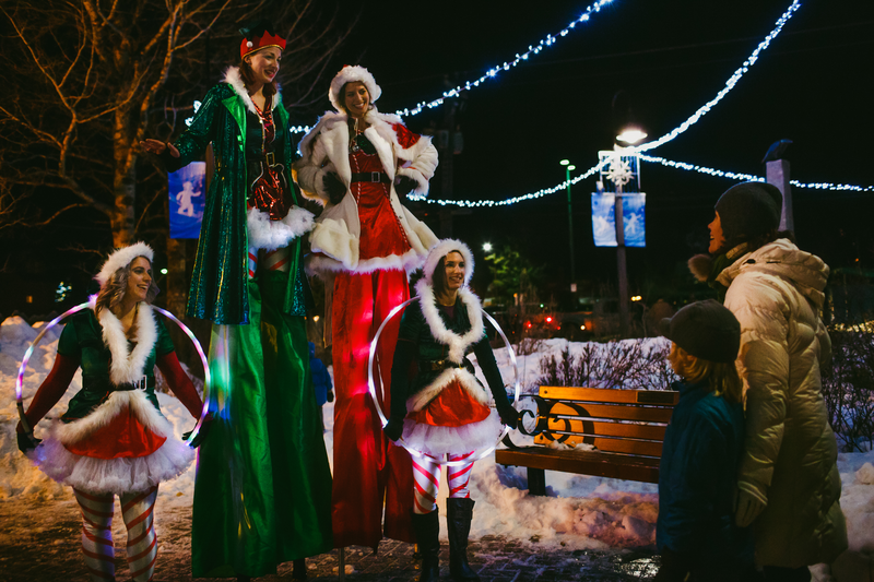 Festive people on the streets of Banff for the Santa Claus Celebration of Lights