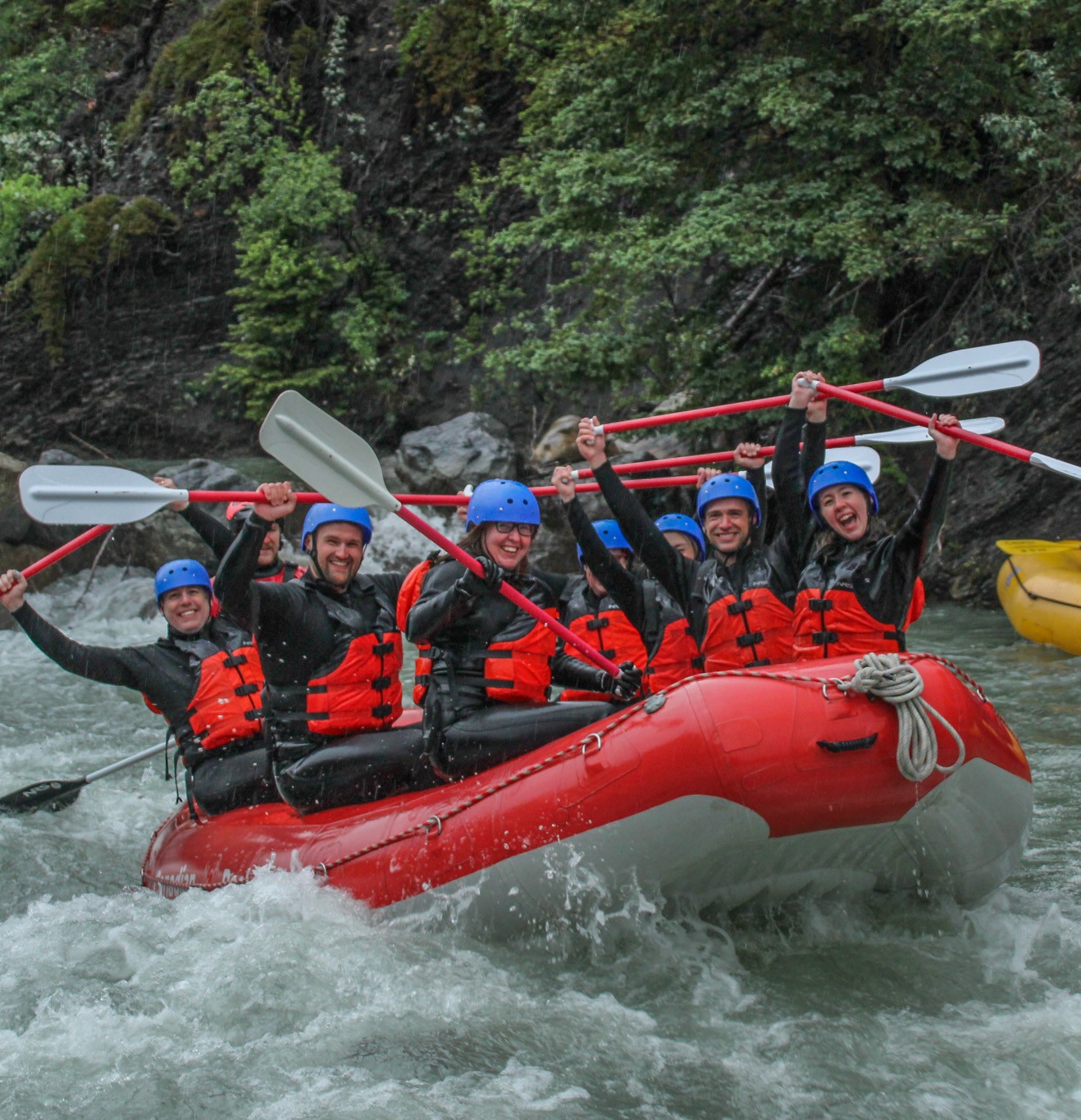 IMG_9053 Red Raft with happy rafters rafting in the rain with Canadian Rockies Rafting