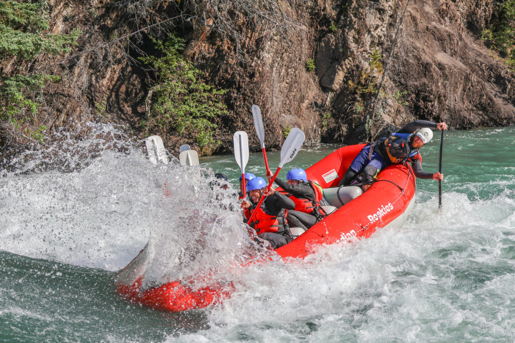Surfing while rafting on the Kananaskis Surf Trip with Canadian Rockies Rafting