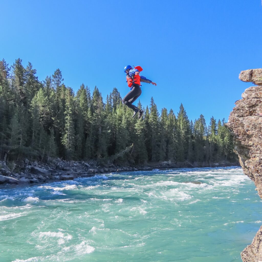 Cliff Jumping while on the Horseshoe Canyon Whitewater Rafting Tour with Canadian Rockies Rafting
